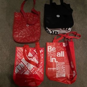 Lulu Lemon Reusable Bags. Set of four different ones. 3 red, 3 black.